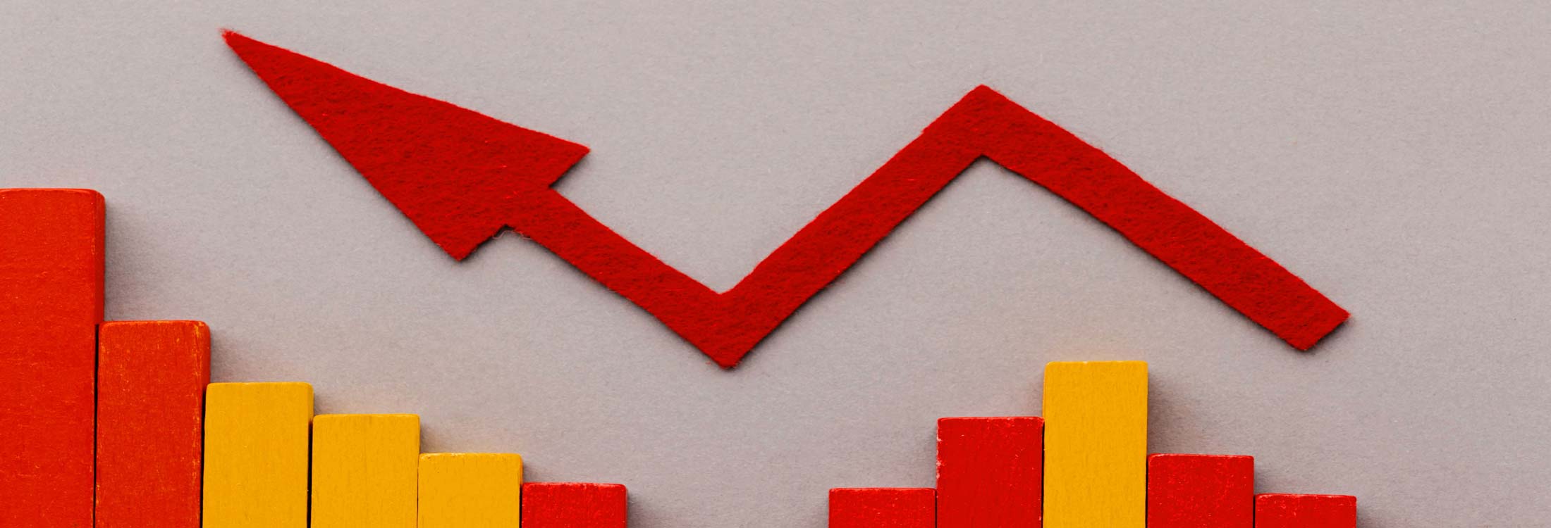 paper-cut-out-of-a-red-arrow-pointing-upwards